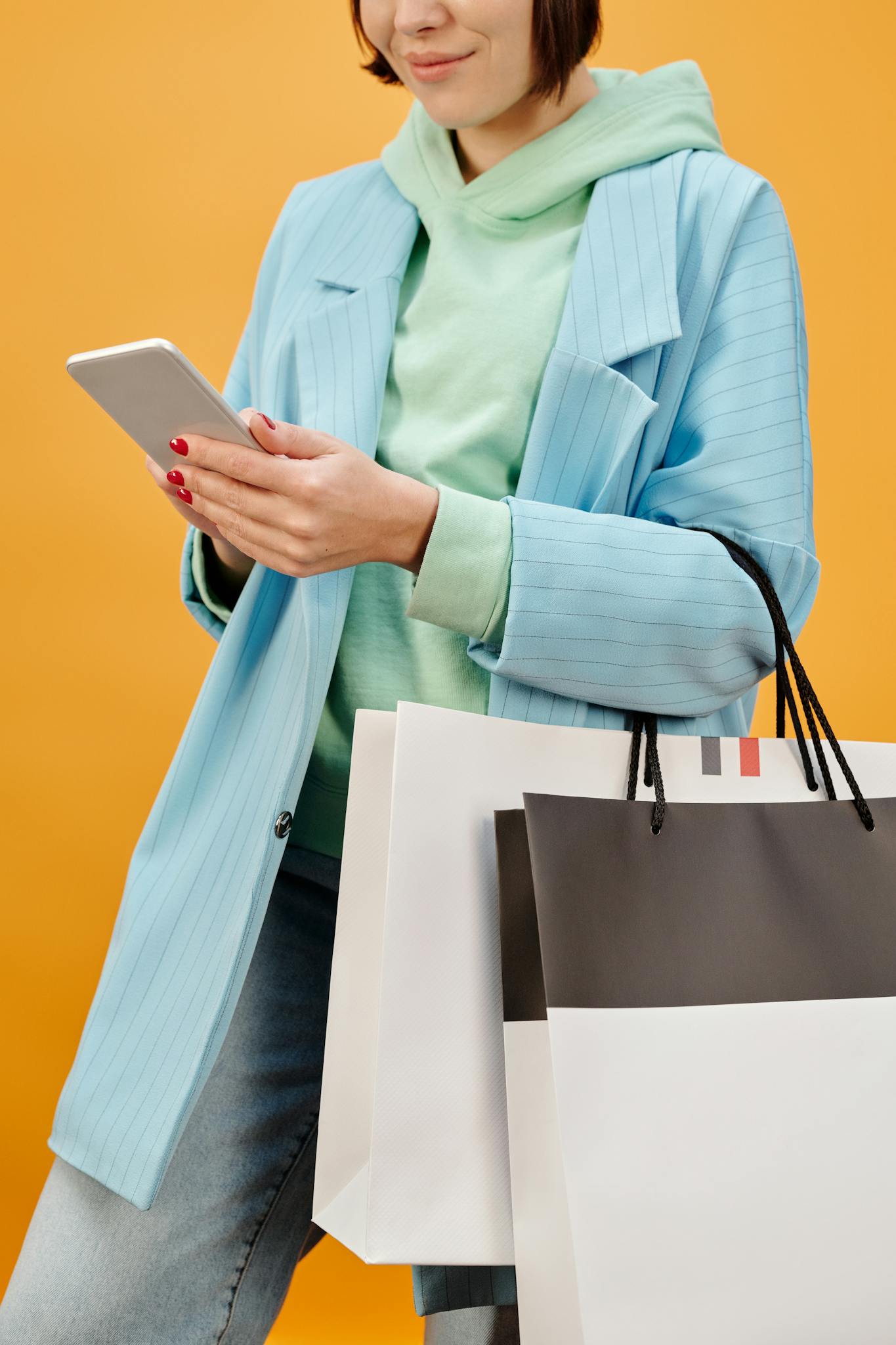 The Essentials of Blogging: Tips and Strategies for Success A Fashionable Woman In Blue Coat Holding