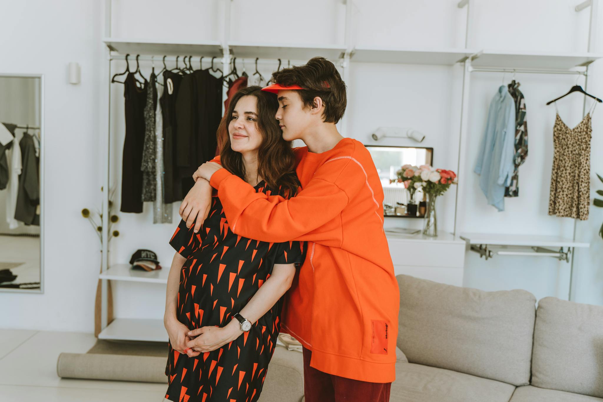 Pregnant Woman And Teenage Son Share An