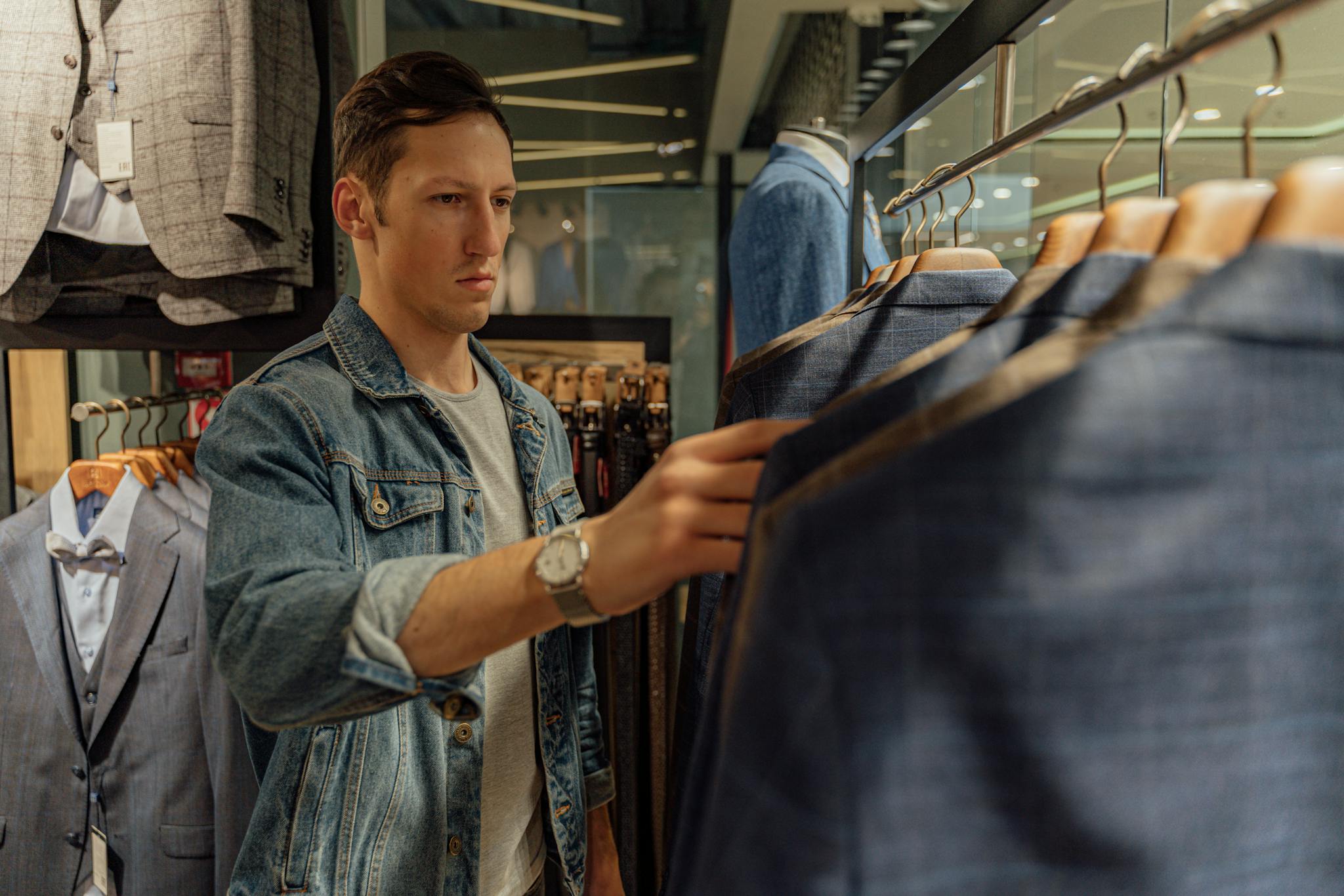 Never Run Out of Ideas: Top Tips for Generating Fresh Blog Topics Young Man Browsing Through Suits In A